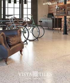 a living room filled with furniture and lots of bikes