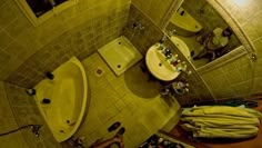 an aerial view of a bathroom with two sinks and a bathtub in the corner