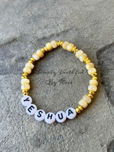 Yeshua / sea shell, gold hematite stone bracelet. #jesus #yeshua #faith #christianjewelry #beaded #bracelet #etsy Gold Personalized Spiritual Beaded Bracelets, Gold Spiritual Bracelets With Letter Beads, Gold Spiritual Bracelet With Letter Beads, Spiritual Gold Beaded Stretch Bracelet, Gold Bohemian Beaded Bracelets With Letter Beads, Bohemian Gold Beaded Bracelets With Letter Beads, Personalized Gold Bohemian Beaded Bracelets, Bohemian Gold Bracelets With Letter Beads, Gold Bohemian Bracelets With Letter Beads