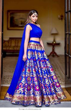 Bollywood Replica Lehenga*Lehenga in Semi-Stitched Banarasi silk fabric with Zari Weaving Work and Waist Support Up To 42  and skirt attached With Canvas ,Lehenga Closer using Drawstring with Length approximately in 41 inches and Flair in 3.5  Meter.Inner in Micro Cotton.Blouse And Dupatta Stitched.Blouse Fabric in plain Georgette with Blouse Pattern in Heart Shape and Blouse Size *Fully Stitched* Size is 38 there Extra Margin So  Can Adjust size from 36" to 42" and *Also att Latest Lahengas, Royal Blue Lehenga, Western Lehenga, Pola Blus, Charro Quinceanera, Brocade Lehenga, Charro Quinceanera Dresses, Mehndi Dresses, Banarasi Lehenga