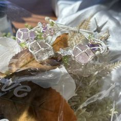 a bunch of flowers that are sitting in some plastic wrap on top of a table