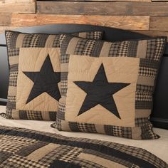 two black and tan stars are on the pillows