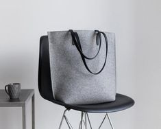 Tote Bag, Felt Bag, Women's Purse, Large Shopper, Merino Wool Felt, Shoulder Bag, Laptop Bag, Woolberry BagElegant and very spacious bag with a zipper and handles made of  leather.This is our most dimensional model. Despite its impressive size, the Long model looks sophisticated and very modern. Her secret is in simplicity of lines and ergonomic shape: side sections visually stretch the silhouette, and the rounded shape of the bottom of the bag looks neat even at maximum filling. In the Long fit Felt Tote Bag, Felt Tote, Purse Gift, Felt Bag, Small Crossbody Bag, Womens Purses, Leather Handles, Leather Handle, Laptop Bag