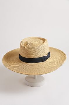 Trust this styled gaucho to keep the season cool. Paper braid shades you with UPF 50 sun protection, beautiful texture, and a 4" brim. And it's finished with a grosgrain ribbon and bow, and an inner drawstring that gives you a comfort fit. 80% Paper Braid, 20% Polyester. Gaucho Hat, Trotter, Beautiful Textures, Hat Band, Art Stuff, Grosgrain Ribbon, Signature Style, Upf 50, Hat Fashion