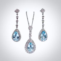 Delicate and classy, this exquisite necklace and earrings set was designed in art deco vintage inspired style. The bright rhodium plated setting perfectly enhances the intricate detailing and conveys a modern take on old elegance. The pieces are adorned by flawlessly faceted cubic zirconia in a vibrant aqua blue color that captures the light from every angle with a perfectly translucent appeal, sparkling beautifully. Necklace: The pendant measures 1.4" (approx. 3.6cm) and hangs on a delicate cab Elegant Pendant Jewelry Sets For Formal Occasions, Elegant Formal Jewelry Sets With Pendant, Elegant Pendant Jewelry Set With Matching Earrings, Elegant White Gold Jewelry Sets With Matching Earrings, Formal White Gold Jewelry Sets With Matching Earrings, Formal Pendant Jewelry Sets With Matching Earrings, Exquisite Sterling Silver Jewelry Sets For Formal Occasions, Sterling Silver Pendant Jewelry Set For Formal Occasions, Elegant Teardrop Pendant Jewelry For Evening