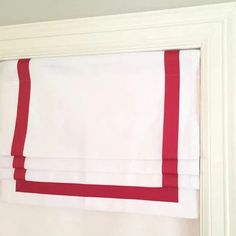 red and white striped curtains hanging on the wall