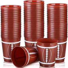 a group of red cups with football designs on them