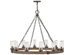 a wooden chandelier with glass cylinders hanging from it's centerpieces