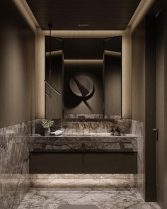 a bathroom with marble counter tops and walls