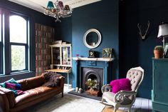 a living room filled with furniture and a fire place