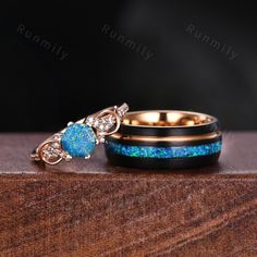 two wedding rings with blue opal and diamonds