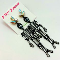 Betsey Johnson Rich Witch Halloween Jewelry Collection Gorgeous Chandelier Earrings With A Black & White Skeleton With Glow In The Dark Accents, Crystal And Faux Pearl Accents At Top Of Earrings, Skeleton Is Movable. Glow In The Dark!!! Earrings Are Approximately 4” Long And 1” Wide. Check Out My Other Listings. Lots Of Betsey Johnson And Other Cute Things. Bundle And Save! Edgy Skull Earrings For Parties, Punk Skull Earrings For Party, Black Skull Earrings For Parties, Glow In The Dark Earrings, Dark Earrings, Skeleton Earrings, Witch Halloween, Betsey Johnson Jewelry, Halloween Jewelry