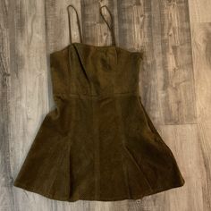 This Golden Brown Dress From Urban Outfitters Is Perfect For The Fall Season. The Knee-Length Corduroy Dress Features A Square Neckline And Strappy Sleeves, Making It A Versatile Addition To Any Wardrobe. The Dress Is A Size Medium And Has A Tie Closure To Adjust The Fit. The Dress Is Brand New With Tags And Is Ready To Be Worn For Any Occasion. Its Unique Fabric Type Sets It Apart From Other Dresses And The Sleeveless Design Makes It A Great Option For Layering. Don't Miss Out On This Stylish And Comfortable Addition To Your Wardrobe. Casual Corduroy Winter Dress, Corduroy Dresses For Spring, Cotton Mini Dress For Fall Date Night, Fall Cotton Mini Dress For Date Night, Fitted Corduroy Dresses For Spring, Spring Casual Corduroy Dress, Casual Spring Corduroy Dress, Fall Cotton Sleeveless Mini Dress, Mini-length Corduroy Dresses For Spring