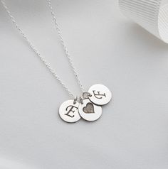 Personalized Initial Discs Necklace | Multi Disc Necklace | Engraved Initial Letter Necklace | Personalized Gift Elevate your style with our exquisite Silver Coin Pendant Jewelry, a perfect blend of elegance and personalization. This beautiful Multi Disc Necklace features meticulously crafted silver coin pendants, each engraved with an initial of your choice, making it a truly unique and meaningful accessory. Product Features: Premium Quality: Made from high-quality sterling silver, ensuring dur Elegant Engraved Stainless Steel Charm Necklaces, Elegant Engraved Stainless Steel Charm Necklace, Elegant Stainless Steel Charms Necklace, Sterling Silver Initials Medallion Jewelry, Sterling Silver Medallion Jewelry With Initials, Sterling Silver Initials Medallion Necklace, Silver Laser Engraved Jewelry For Anniversary, Sterling Silver Medallion Necklace With Initials, Engraved Stainless Steel Necklace As A Gift For Her