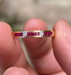 Please read every details carefully - This ring is second-hand from pawn shop. **Please feel free to contact me if you need more details or additional pictures** Beautiful Timeless Minimal Design, Small Rubies and Diamonds on 18k Yellow Gold Ring -Second-hand- I think it's from around 20-30 years ago but I am not sure of the precise date. I got this ring from pawn shop in Thailand. It's very stunning. This ring is in good condition- Metal Type: 18K Yellow Gold Total Weight: 3.05 grams Band Width: 3.1 mm. (Please Check the ring dimension again in the pictures, I did list the dimension of the ring) Ring Size: 7 US  Gemstones and Diamonds Gemstone: Natural Ruby Gemstone dimension: approx. 1.7x1.7 mm. - 9 pieces Gemstone Cut: Square Diamond Shape: Round Diamond Total Weight: approx. 0.01 Ct. ( Luxury Ruby Ring Channel Set For Anniversary, Classic Formal Ruby Ring With Channel Set, Classic Channel Set Ruby Ring For Formal Occasions, Classic Ruby Channel Set Rings, Ruby Ring With Channel Set Diamonds In Yellow Gold, Yellow Gold Ruby Ring With Channel Set Diamonds, Timeless Ruby Ring With Vvs Clarity For Wedding, Elegant Ruby Ring Channel Set For Anniversary, Luxury Ruby Ring Princess Cut For Anniversary