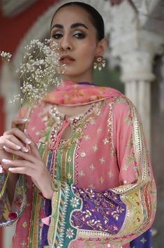 A watermelon pink khaddi silk kurta is artfuly rendered in print in hues of magenta, pistachio green and hints of turquoise. Luxe hand embellished gota detail and touching make this an absolute must-have formal piece for the festive season. A matching printed medium silk Dupatta with gota touching and rawsilk izaar wit Mayon Dresses, Sania Maskatiya, Embroidery Fashion Detail, Pakistani Formal Dresses, Fashion Dresses Formal, Bridal Applique, Pakistani Fashion Party Wear, Bridal Dress Fashion