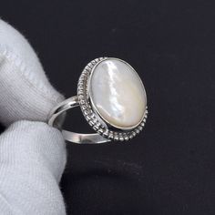 Welcome to your Shop Shop Link : https://uniquejewelstudio.etsy.com Stone: Mother Of Pearl Gemstone Shape: Oval Shape Ring Size:- All Size Ring Weight : 3 to 8 gm Metal:- Pure 925 Sterling Silver Jewelry Type:- Ring Stock Code : SR-1068 Benefits of Mother's Of Pearl, Wearing Mother Of Pearl as jewelry is beneficial to the soft tissue, muscle tissue, heart, and joints. It will help you connect with the power of water, providing calming and subtle energy. This will help to guard you against negati White Crystal Birthstone Ring For Gift, White Crystal Birthstone Ring As Gift, White Birthstone Ring As A Gift, White Birthstone Ring For Gift, White Birthstone Rings As Gifts, Handmade Ring Jewelry For Birthday, Handmade Ring For Birthday, Handmade Birthday Ring, White Opal Ring Gift