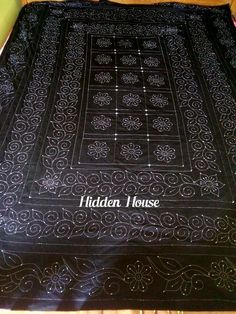 a black blanket with white writing on it