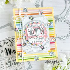 a birthday card made with the stamp set from simons stamps and some flowers on a table