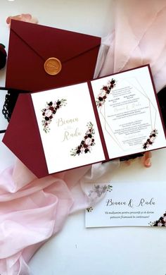 the wedding stationery is laid out next to an envelope