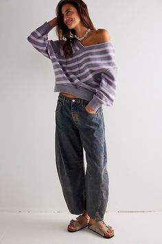 So bold barrel jeans from our We The Free collection featured in a mid-rise fit with subtle distressed detailing and wide-legs that taper at the ankle. **Fit:** Mid-rise, slouchy, relaxed fit, wide-legs, ankle-length; this style runs slightly large so we recommend sizing down one size **Features:** Button closure, rigid denim fabrication, belt loops at waistband, 4-pocket style, subtle distressing, tapered bottom hem, seam detail throughout **Why We | We The Free Good Luck Mid-Rise Barrel Jeans Spring Denim, Baggy Style, Denim Trends, Free People Jeans, Stripe Sweater, Boho Outfits