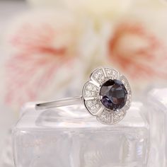 Art Deco Bridal Wedding Ring / Round Cut 1.00CT Alexandrite Ring/ Fantastic Women's Promise Gold Ring/ Accents Moissanite Ring/ Fine Jewelry ------------Specifications------------ Engagement Ring: Center Stone - 6.5mm Round Cut Alexandrite - 1.00CT Stone Clarity - VS Side Stones - 0.22ctw Moissanite Width of the Band - 1.50mm Weight of the Gold - 3.10g ------------SIZES------------ This ring is made to order in any size, please drop down the Options box to choose the gold color and ring size. Si White Gold Topaz Ring With Halo For Anniversary, Wedding Birthstone Ring With Halo Design In Cubic Zirconia, Silver Halo Birthstone Ring For Wedding, Classic Gemstone Flower Ring For Wedding, Classic Wedding Flower Ring With Gemstone, Anniversary Topaz Ring With Halo Design, White Gold Birthstone Ring With Halo Setting For Wedding, Silver Topaz Ring With Halo For Wedding, White Gold Halo Birthstone Ring For Wedding