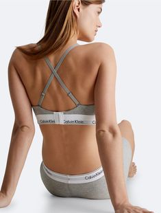 A Calvin Klein icon that offers customizable, versatile support for post-surgery wear. This modern cotton bralette is the definition of effortless. Made with super soft and supple cotton stretch blended with modal for all day comfort. Designed with the original Calvin Klein logo band, this is a sporty look that feels sexy everyday.  Material: 53% Cotton. Cotton Bralette, Post Surgery, Sporty Look, Surgery, Bralette, Calvin Klein, Band, How To Wear