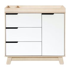 a white dresser with black handles and drawers on the bottom shelf, against a white background