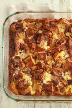 a casserole dish with bread and cheese in it