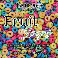 a bunch of colorful donuts with the words fruit logs written in white above them