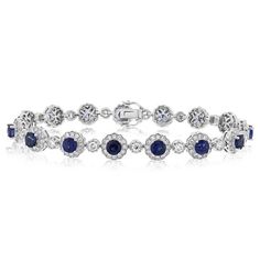 18k white gold sapphire and diamond bracelet from the Reis-Nichols Collection. The bracelet features 15 round sapphires weighing 6.64 ctw and 195 round brilliant cut diamonds weighing 2.85 ctw. Luxury Sapphire Diamond Round Bracelet, Luxury Sapphire Diamond Bracelet, Luxury Sapphire Bracelet With Diamond Accents, Luxury Sapphire Diamond Bracelet With Accents, Classic Sapphire Diamond Bracelet With Brilliant Cut, Sapphire Color Brilliant-cut Cubic Zirconia Bracelets, Luxury Sapphire Tennis Bracelet With Diamond Accents, Classic Diamond Bracelet With Sapphire, Sapphire Diamond Bracelet With Brilliant Cut