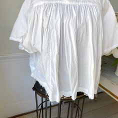 Hello and welcome to the Textile Trunk! Please follow us on Instagram , our user name is textiletrunk A fabulous rare find! Lace trimmed, GORGEOUS! his textile is a choir blouse dating from c 1900 or late 1800's. Made of crispy white cotton , This shirt was a Choir blouse and has lovely mends! ~ it was used and loved. The bottom of this chior shirt is cut, with no hem so probably had a lace addition that was removed ( condition reflected in the price ) ( Eshirt 85) MEASUREMENTS : This textile me Peasant Cotton Blouse For Gatherings, Peasant Style Cotton Blouse For Gatherings, White Cotton Blouse For Gatherings, White Cotton Tops For Gatherings, Cotton Peasant Top With Lace Trim For Daywear, Cotton Peasant Blouse For Daywear, Fitted Cotton Tops For Gatherings, Fitted Cotton Peasant Top, Fitted Cotton Peasant Top For Daywear