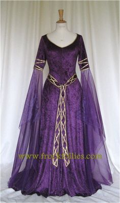 EVE, CELTIC IN INSPIRATION, ELEGANT AND FLOWING IN DEEP PURPLE CRUSHED VELVET WITH GOLD TRIM IS DESIGNED AND CUSTOM MADE BY frockfollies. PERFECT Elven Style Wedding Dress With Historical Design, Elven Wedding Dress With Historical Design, Wedding Medieval Dress With Fitted Bodice, Fitted Medieval Wedding Dress With Historical Design, Fantasy Style Fitted Wedding Gown, Medieval Wedding Gown With Historical Design, Medieval Wedding Dress With Historical Design, Fantasy Wedding Gown With Fitted Bodice, Fitted Fantasy Wedding Gown