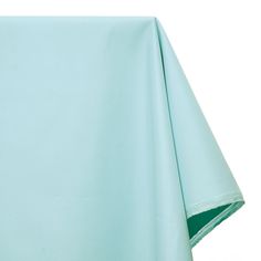 a light blue sheet is folded up on a white background