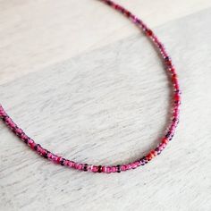 "A long pink and fuchsia mixed glass bead necklace.  The closure is a pewter toggle clasp.  The long hand beaded necklace is available in two lengths (see photo with two options) - 30\" and 36\".  The colors of the beads are a mix of raspberry, cranberry and light pink tones.  The necklace can be wrapped around the wrist several times for a multi-layered bracelet.  You can also purchase charms to be added to the necklace from my shop here (make note at checkout that you wish for charms to be attached): https://www.etsy.com/listing/1147255532/personalized-sterling-silver-charm?click_key=41a8f205aa77c475953fc701d4090ca3beec6950%3A1147255532&click_sum=06541664&ref=shop_home_active_2&crt=1&sts=1 Your long glass beaded necklace will arrive in an E. Ria Designs jewelry gift box, ready for giving Pink Beaded Chain Jewelry For Gift, Pink Tiny Beads Necklace For Jewelry Making, Pink Beaded Necklace With Tiny Beads For Gift, Purple Single Strand Beads For Gift, Pink Single Strand Beaded Necklace For Gift, Single Strand Purple Beads For Gift, Purple Single Strand Beads As A Gift, Pink Spacer Bead Necklaces For Festivals, Pink Spacer Beaded Necklace For Festivals