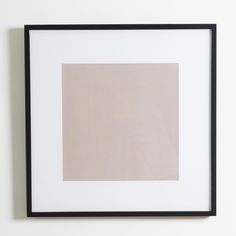 a white and black framed photograph hanging on a wall