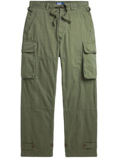 olive green cotton twill weave herringbone belt loops adjustable side straps drawstring waist two diagonal pockets to the sides two side cargo pockets two rear flap pockets adjustable button ankle tabs wide leg Green Cotton Cargo Jeans With Flap Pockets, Military Olive Cargo Pants With Side Pockets, Olive Military Cargo Pants With Side Pockets, Utility Olive Parachute Pants With Pockets, Green Cotton Combat Cargo Pants, Olive Cargo Trousers With Pockets, Green Combat Cotton Cargo Pants, Olive Military Cargo Pants With Multiple Pockets, Olive Military Pants With Cargo Pockets