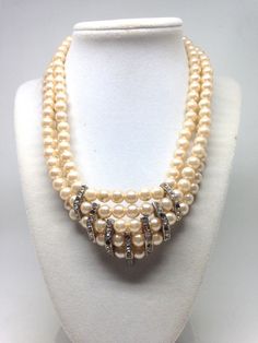 "Vintage Estate Rhinestone Faux Pearl Collar Bib Gorgeous Necklace This lovely piece can be worn on any occasion and is absolutely beautiful in the light, both inside and out, the perfect gift for anyone who loves vintage jewelry. - Measures Approx. 17\" long - Each order comes shipped in a small drawstring pouch, all ready for gifting. -If you are wanting to have this mailed as a gift to a special someone, please write their address in the note section, otherwise it will be mailed to you. -If y Vintage Pearl Jewelry With Rhinestones, Vintage Rhinestone Necklace For Gift, Vintage Pearl Jewelry For Evening, Vintage Rhinestone Necklace For Anniversary, Vintage Pearl Necklaces With Rhinestones, Vintage Round Bridal Necklace For Anniversary, Vintage Bridal Necklace For Anniversary, Vintage Jeweled Bridal Necklace Gift, Vintage Pearl Necklace With Crystal For Wedding