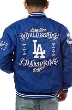 Los Angeles Dodgers 2020 World Series Champions Bomber Jacket with Hidden Snap Tab Buttoned Closure Winter Crew Neck Outerwear With Embroidered Logo, Blue Outerwear With Baseball Collar For Sports Events, Blue Outerwear With Embroidered Logo For College, Blue Embroidered Outerwear For College, Blue College Varsity Jacket With Button Closure, College Blue Varsity Jacket With Button Closure, Blue Varsity Jacket For Streetwear, Blue Varsity Jacket With Button Closure For College, Blue Varsity Jacket With Button Closure For Streetwear