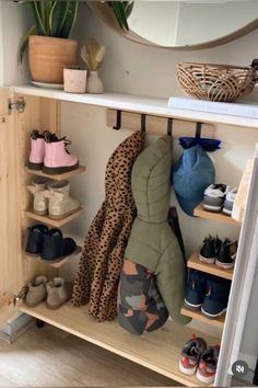 a shelf filled with lots of shoes and blankets