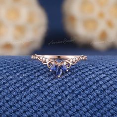 a close up of a ring on a blue cloth