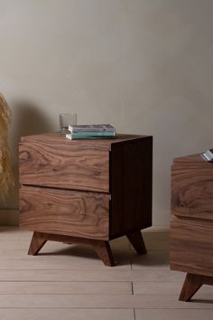 two wooden nightstands side by side on the floor