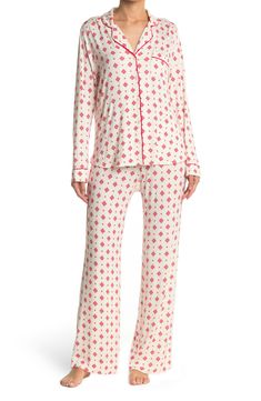 A soft jersey knit pajama set with a pretty print delivers feminine style and essential comfort. 2-piece set Shirt: 25" length (size S); Pants: 9.5" rise, 32" inseam (size S) Shirt: notch lapel, long sleeves, front button closures, chest patch pocket, allover print, contrast piping, knit construction Pants: elasticized waist, pull-on style, allover print, knit construction 95% rayon, 5% spandex Machine wash cold Imported Model’s stats for sizing: 5’11” height, 32” bust, 24” waist, 34” hips. Mode Casual Printed Long Sleeve Sleepwear, Casual Long Sleeve Printed Sleepwear, Cozy Fitted Loungewear Sets, Long Sleeve Printed Loungewear Sets, Long Sleeve Printed Lounging Sets, Printed Long Sleeve Lounging Sets, Long Sleeve Printed Lounge Sets, Fitted Long Sleeve Sleepwear For Pajama Party, Printed Sets For Loungewear With Long Pants