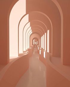 an image of a long hallway with arches on both sides and light at the end