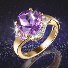 An endearing design that is meant to be worn every day. Finely crafted from sterling silver, finished in luxurious 18k yellow gold. An oval cut Amethyst sits at the heart, flanked with more shimmering Amethysts and complemented with sparkling ice white Diamondeau®, flawless simulated diamond. This is a ring that makes a statement on its own, or mixed up with other rings to give an edgy look. Elegant Amethyst Ring With Gemstone Accents For Promise, Elegant Amethyst Birthstone Diamond Ring, Elegant Amethyst Cubic Zirconia Birthstone Ring, Amethyst Ring With Cubic Zirconia Accents For Anniversary, Elegant Amethyst Birthstone Ring In Cubic Zirconia, Elegant Gold Gemstones For Promise Rings, Luxury Amethyst Ring With Diamond Accents For Anniversary, Exquisite Amethyst Rings With Gemstone Accents, Exquisite Amethyst Ring For Anniversary