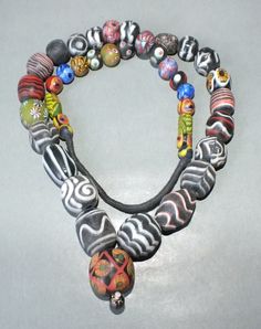 This necklace with different colorful handmade glass beads originates from Thailand. The hanging length of the strand is 36 cm. The diameter of the beads is 0.9 cm to 2.5 cm. Its weight is 190 gram. (e13) SHIPPING SHIPMENT is FREE. All items are shipped within two working days after receipt of payment. We send everything by registered airmail. Insured packets (over 50 cm length / over 1500 gram) I send by standard way. PAYMENT Paypal is preferred. RETURN POLICY: NO RISK: Any item may be sent bac Multicolor Amulet Beaded Necklaces As Gift, Multicolor Single Strand Necklace For Festival, Multicolor Czech Glass Oval Bead Necklace, Multicolor Czech Glass Necklace With Oval Beads, Multicolor Czech Glass Necklaces With Oval Beads, Multicolor Polished Czech Glass Necklaces, Multicolor Beaded Necklace With Pendant, Traditional Multicolor Single Strand Beads, Unique Multicolor Long Beaded Necklace