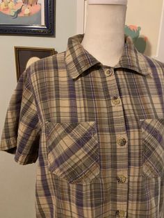 Vintage women's plaid short sleeve collared shirt with button front and two chest pockets.  Label: Erika  No size label  Measurements taken flat, please double where needed  Shoulder to shoulder: 15 inches  Underarm to underarm: 20.5 inches  Sleeve length: 8 inches  Shoulder to hem: 20.5 inches Plaid Relaxed Fit Short Sleeve Button-up Shirt, Relaxed Fit Plaid Short Sleeve Button-up Shirt, Plaid Cotton Short Sleeve Shirt With Button Closure, Plaid Short Sleeve Cotton Flannel Shirt, Plaid Collared Short Sleeve Shirt With Relaxed Fit, Collared Plaid Short Sleeve Shirt With Relaxed Fit, Plaid Cotton Flannel Shirt With Short Sleeves, Relaxed Fit Collared Short Sleeve Plaid Shirt, Relaxed Fit Plaid Collared Short Sleeve Shirt