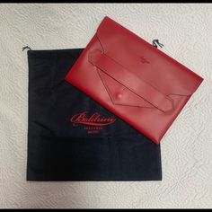 Nwt Stylish Red Clutch By Boldrini Selleria Bag Details: *Genuine Florentine Vacchetta Leather *Made In Italy *One Storage Compartment *Magnetic Snap Flap Closure *Dust Bag Included Measurements: Approx. 13” L X 9.5” H X 1” D Please Feel Free To Ask Any Questions That You May Have In The Comments! This Beauty Will Be Shipped Usps Priority From A Pet Free/Smoke Free Home! Sugar Skull Design, Business Briefcase, Red Clutch, Embroidered Clutch, Suede Clutch, Straw Clutch, Bag Details, Vintage Clutch, Wristlet Purse