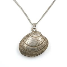 "Vintage sterling silver clam shell pendant on delicate sterling curb chain. This shell pendant has a beautiful amount of detail. Likely made near the middle of the last century. This sweet piece will hold you over until you're able to get back to the ocean. Shell marked \"Ster\", chain marked \"Sterling\". In good vintage condition. Chain measures: 17.5\" Long Pendant measures: .73\" Tall (not including bail) x .73\" Wide Weight: 3.52 grams *Domestic Orders Over $35 Ship Free* All items ship US Clam Shell, Shell Necklace, Long Pendant, Vintage Beach, Shell Pendant, Shell Necklaces, Curb Chain, Beach Jewelry, Vintage Sterling Silver