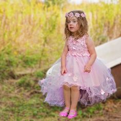 Pale Pink Flower Girl Dress Our Fiona dress in pale pink is the flower girl dress that young ladies’ dreams are made of. This rose-tinted style features spaghetti straps, a flower-embossed bodice, a flowing high-low skirt of tulle, and a satin back bow. The wire hem detailing creates a whimsical touch of volume at the base. Your little one will just love skimming the grass with the hem of her skirt as she dances to her heart’s content. Shop the Fiona Dress in Mimi Pink Young lovers of Small Quince, High Low Tulle Skirt, Pink Birthday Dress, Silver Weddings, Pink Dresses For Kids, Pink Flower Girl Dress, Sara Dress, Pink Flower Girl, Pink Flower Crown